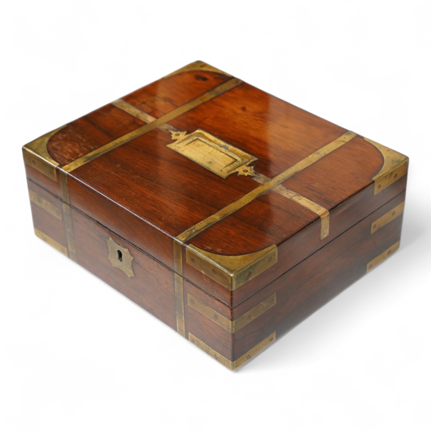 A George IV mahogany and brass bound campaign vanity box with original fittings, 27cm wide x 23cm deep x 10cm high